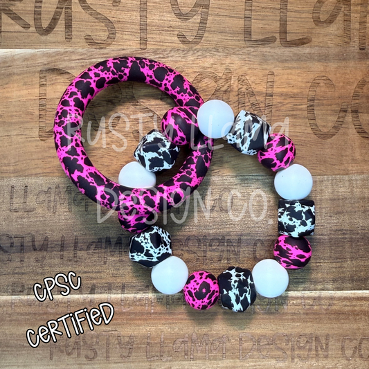 CPSC-Certified Silicone Baby Rattle – Pink Cow Print