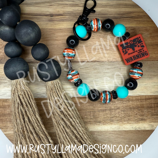 Should have come with a Warning Keychain Wristlet